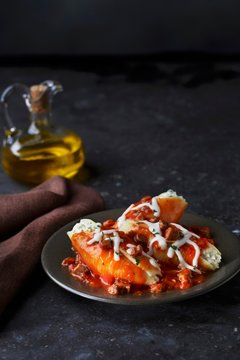Giant pasta shells filled with tomato sauce