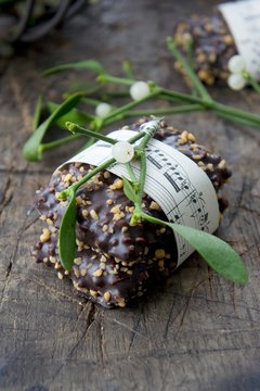 German gingerbread biscuits with slivered almonds and a sprig of mistletoe