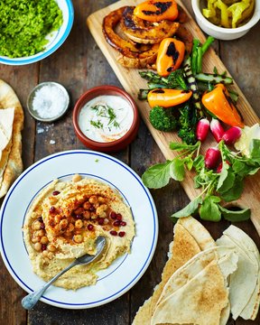 Mezzo platter with hummus, pita bread and roasted vegetables