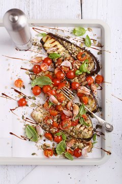 Grilled aubergines with tomatoes, garlic and fresh basil