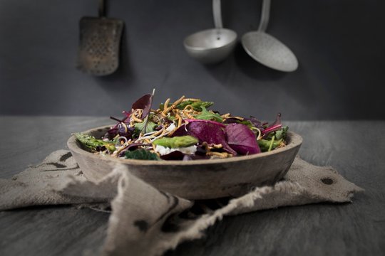 A mixed leaf salad with asparagus, goat's cheese and buffalo worms