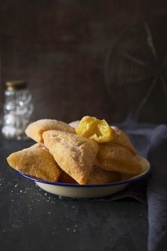 Deep-fried pastries made with semolina flour and sugar