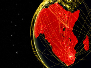 Obraz premium Africa on dark Earth with network representing telecommunications, internet or intercontinental air traffic.