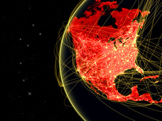 North America on dark Earth with network representing telecommunications, internet or intercontinental air traffic.