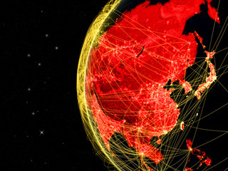 Asia on dark Earth with network representing telecommunications, internet or intercontinental air traffic.