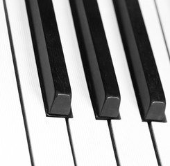 Naklejka premium three black piano keys and white ivory keys