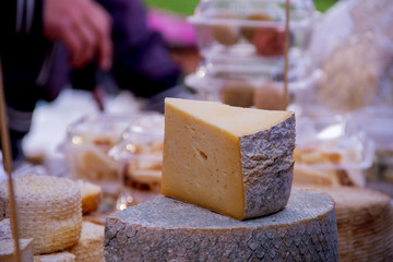 Chopped Gouda cheese on the background street food fastiva