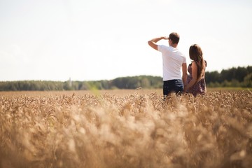 man and woman in field