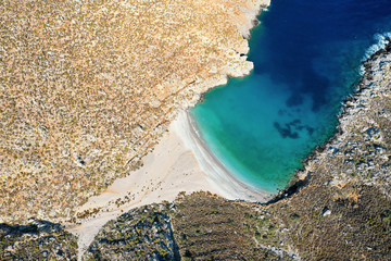 Bird's eye view of bay with beautiful beach near Sikati cave, Kalymnos, Greece