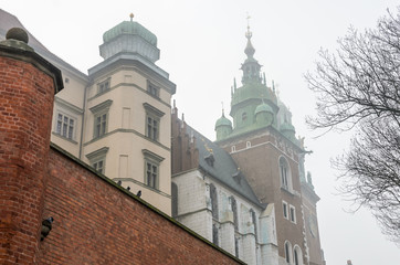 Fototapeta na wymiar Wawel Castle in the morning fog in Krakow, Poland