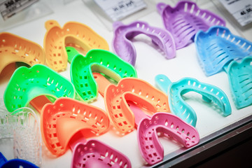 samples of colorful plastic dental impression trays