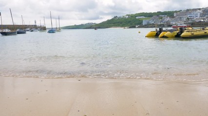 Sea lapping against St Ives beach, on a gorgeous summer day.
