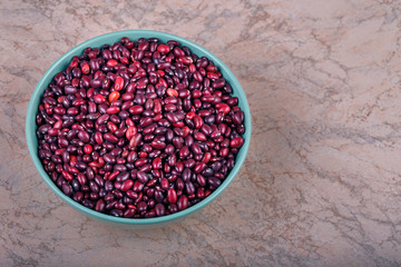 The concept of natural healthy food. Red beans in the bowl closeup