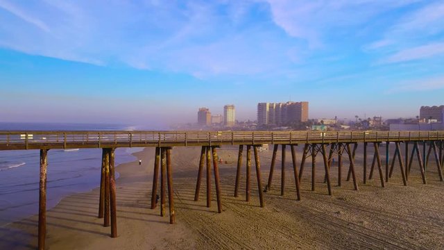 Rosarito Beach Pier lies on the coast of the Pacific Ocean on the Baja California Peninsula. The city is positioned between the foothills of the Peninsular Ranges and the ocean. 