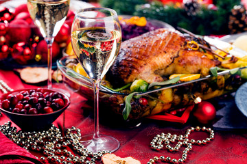 Christmas themed dinner table with champagne glass