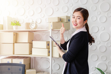 Portrait Asian young women standing smile in home office,Start up small business SME