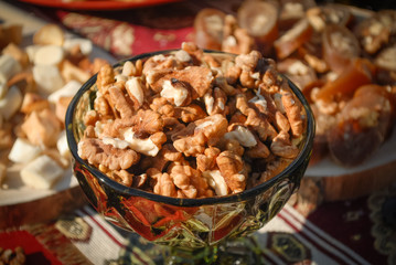 Nuts in a glass bowl/pot.