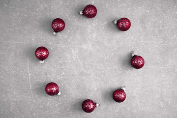 Christmas creative composition. Xmas red decorations on grey texture background. Christmas, New Year, winter concept. Flat lay, top view, copy space 