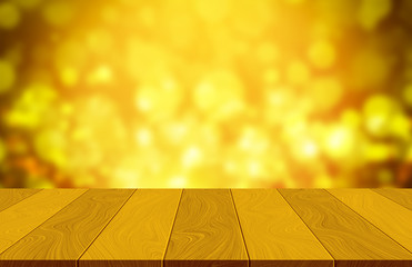 Empty wooden table on orange background with bokeh light - can be used for display or montage your...
