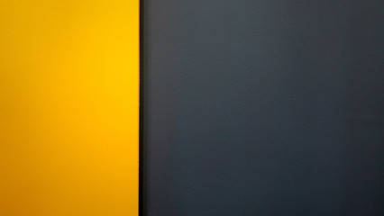 Plywood background painted yellow and black. Blank space for backgrounds, text or logos.