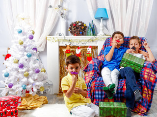 Fototapeta na wymiar Happy children playing in Christmas decorative room