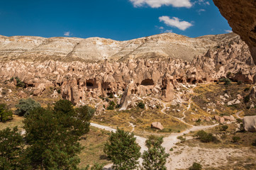 View from the structure of Cappadocia. Impressive fairy chimneys of sandstone in the canyon near Cavusin village, Cappadocia, Nevsehir Province in the Central Anatolia Region of Turkey. Overcast sky