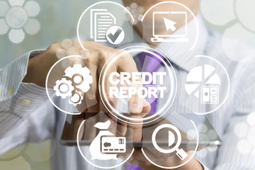 Businessman touch a screen tablet with credit report words icon on a virtual interface. Financial business digital audit accounting concept.