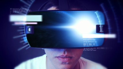 Young man wearing VR headset and experiencing virtual reality. Technology related digital earth network concept.