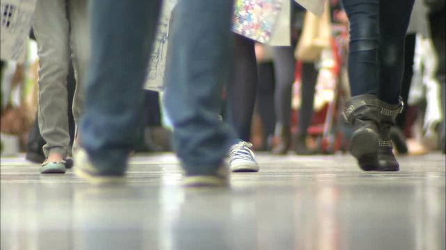 Anonymous Feet walking in a busy UK Shopping Mall