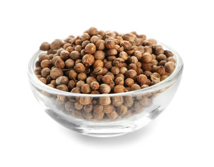 Glass bowl with coriander on white background