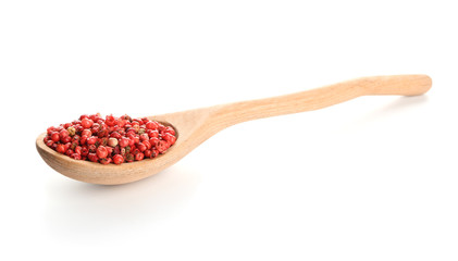 Wooden spoon with red pepper on white background