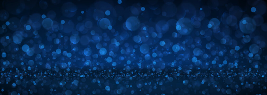 Blue abstract blurred banner with bokeh effect.