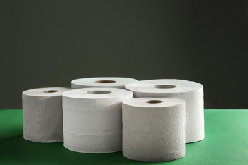 Rolls of toilet paper on color table