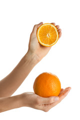 Female hands with oranges on white background