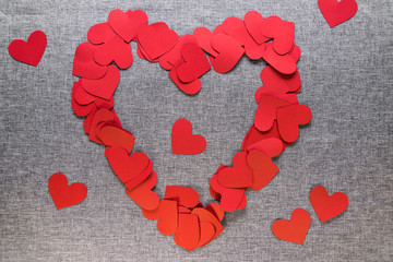 red paper hearts on a gray background