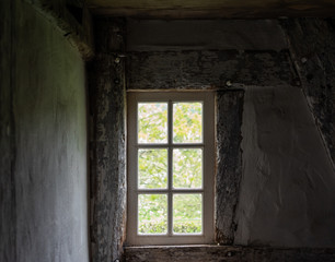 The window of an old farmhouse, inside