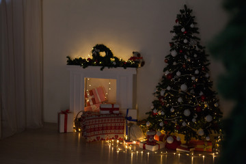 Christmas tree with lights light Garland and gifts for the new year