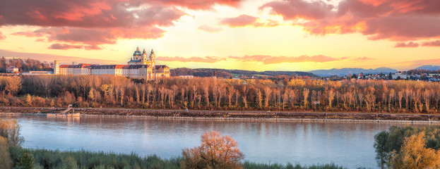 Panorama of Melk abbey with Danube river and autumn forest - obrazy, fototapety, plakaty