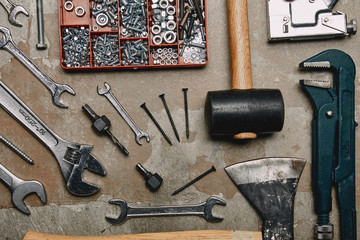 Flat lay with set of carpentry tools on old background