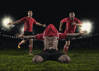 Soccer player on stadium celebrating a goa