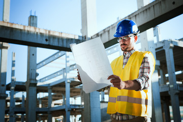 Young handsome business man construction site engineer
