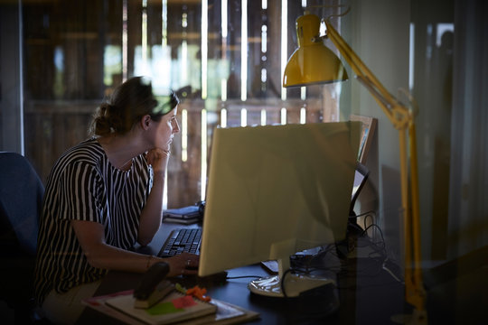 Creative businesswoman working at computer desk in office