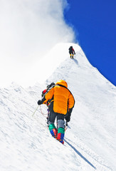 Group of  climbers reaching the summit