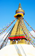 Tibetan flags in Boudhanath Stupa, Nepal. View of Boudhanath Stupa. Top of Stupa Boudhanath with prayer flags, Kathmandu,