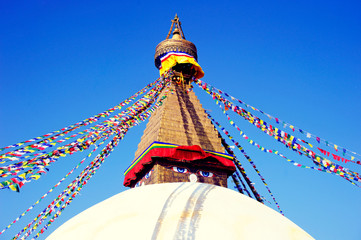 View of Boudhanath Stupa. Top of Stupa Boudhanath with prayer flags, Kathmandu, Nepal.