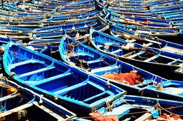The blue boats docked in the Medina Essaouira. Essaouira port in Morocco. Fishing blue boats in...