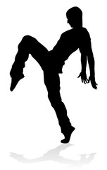 A male street dance hip hop dancer in silhouette