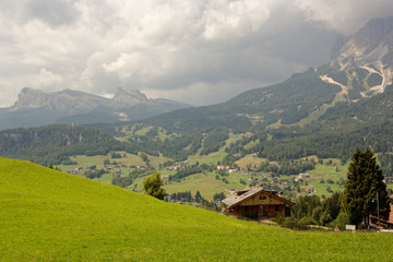 Fototapeta na wymiar panoramic view of the dolomite mountains. Mountain village Cortina di Ampezzo.
