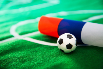 Russia flag and soccer ball on green grass field