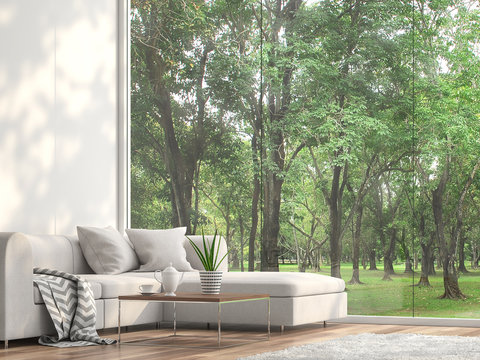 Minimal Sofa Located At The Window 3d Render.The Rooms Have Wooden Floors And White Wall.furnished With White Fabric Furniture.There Are Large Frameless Window Looking Out To See The Garden View.